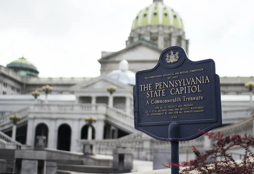 Sign saying The Pennsylvania State Capitol in front of the capitol building
